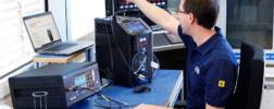 Employee in the calibration laboratory calibrating temperature measuring instruments.