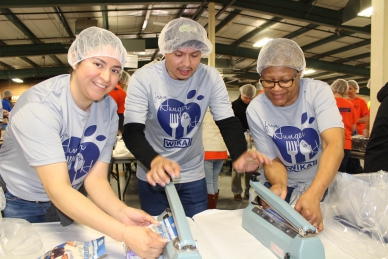 WIKA employees pack meals